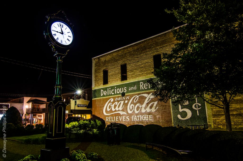 New Albany clock and Coca-Cola mural